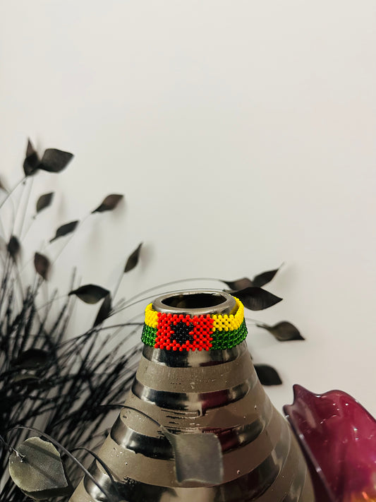 The Guinea-Bissau Flag Bracelet, an AfroCrafted piece, is made with glass beads intricately handwoven to reflect the vibrant colors of the Guinea-Bissau flag